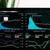 Analytics dashboard with growth charts on a laptop screen.