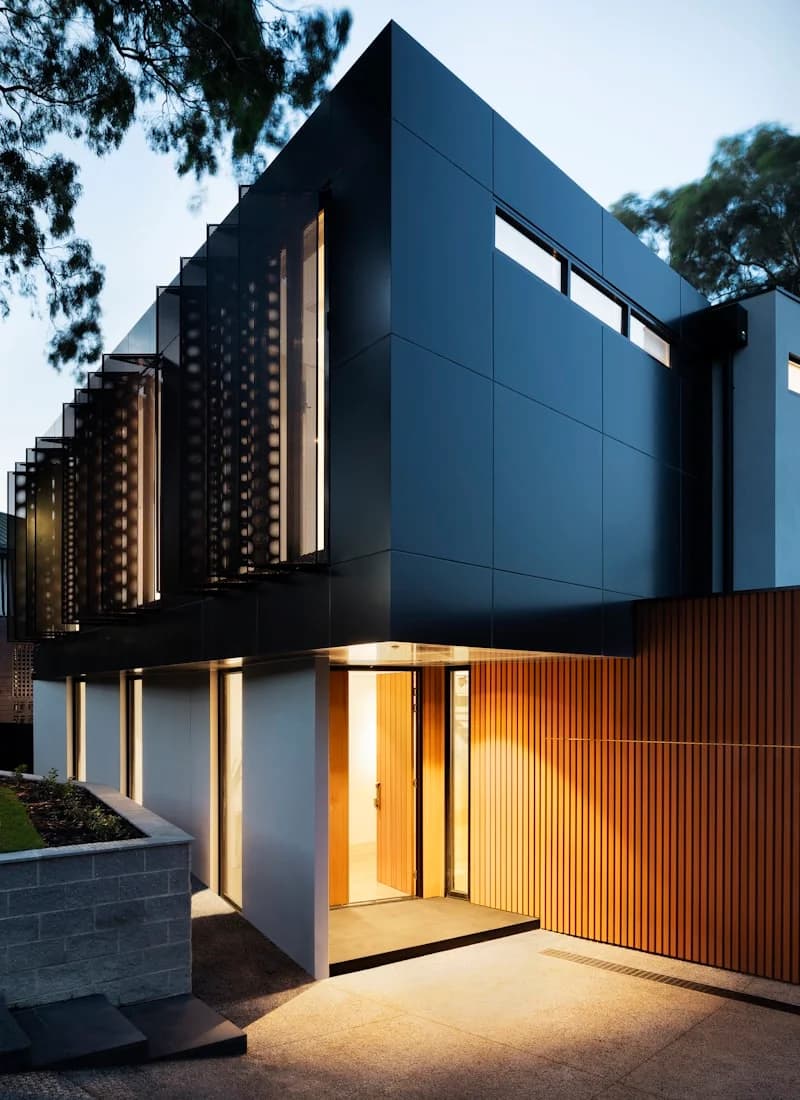 Glass pavilion opening onto a landscaped courtyard
