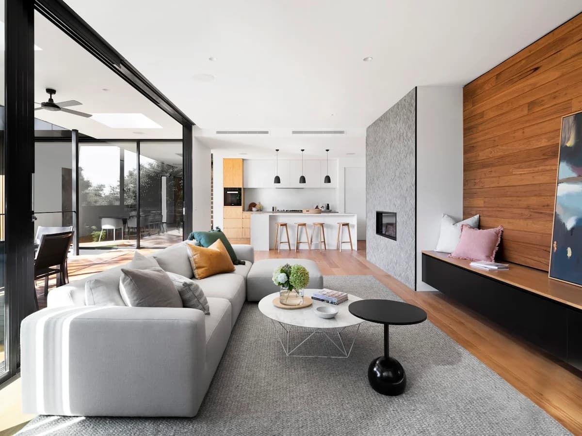 Modern timber and glass residence on a wooded ridge